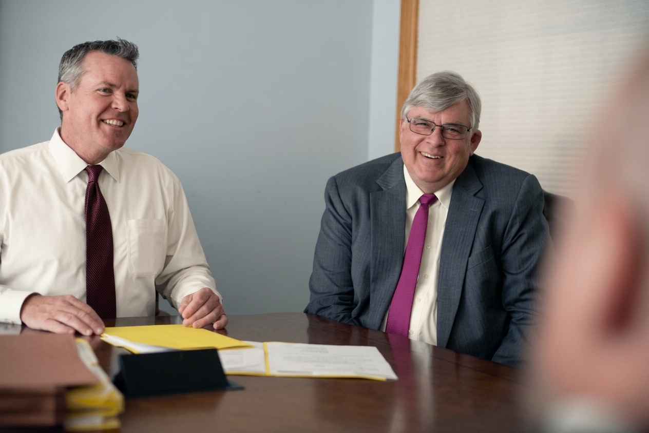 George K. Rahdert (1950–2025) and Steve Mortimer at the firm's conference table