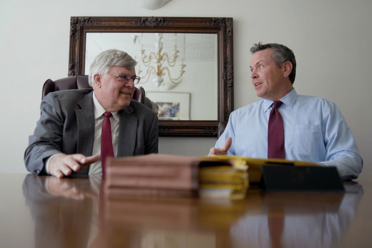 George K. Rahdert (1950–2025) and Steve Mortimer in conversation at the conference table